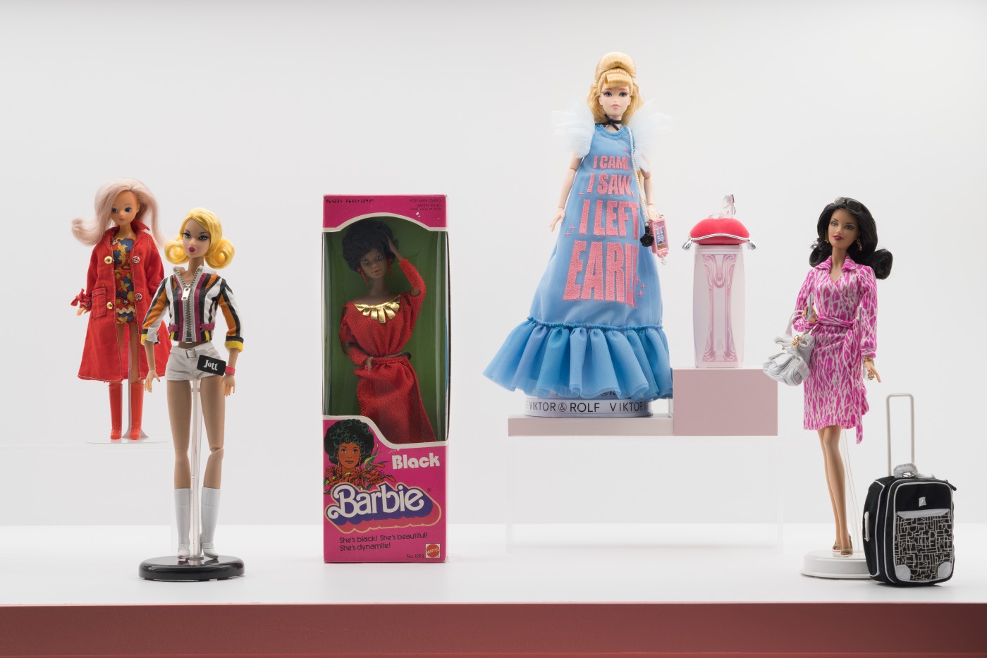 Modern and contemporary fashion dolls: Let to Right-Daisy by Mary Quant, Jett by Jason Wu and David Buttry, Black Barbie by Mattel, Viktor & Rolf x Disney Collector, and Diane von Furstenberg. © Museum at FIT