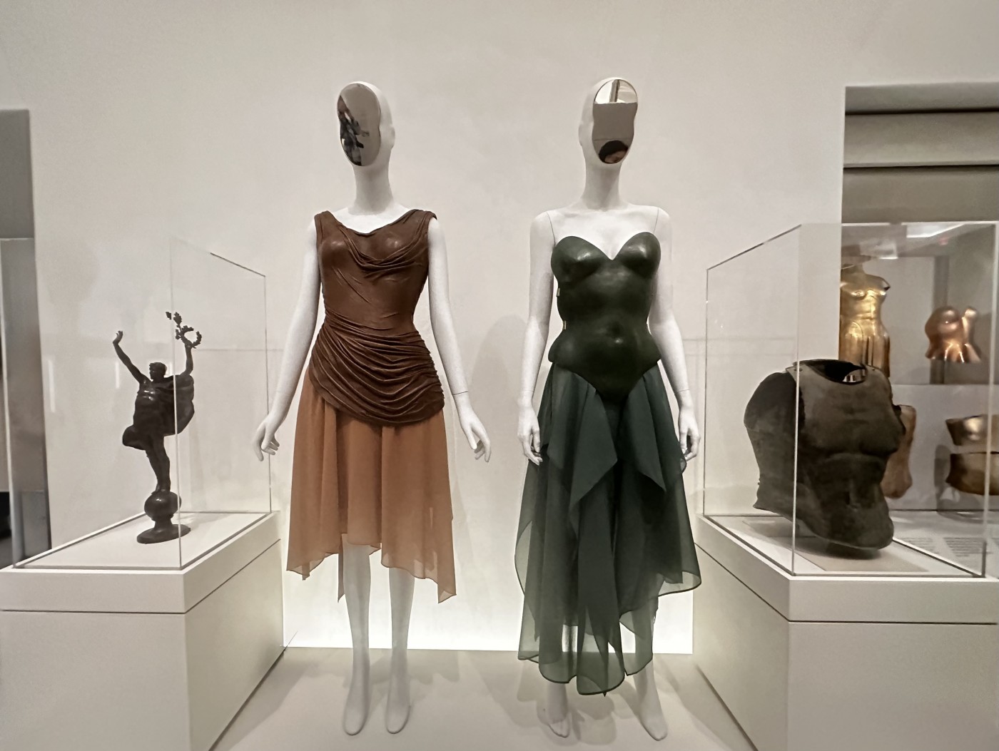 Vital Body:  Vivienne Westwood (British) Mr. Pearl Martyr to Love jacket. Embroidered Silk Satin & Polychrome glass, crystals and clear pailettes, 1996-97 Man. Robert Wun (Hong Kong) Bleeding Coat 2024. Vital Body Diorama. Costume Art © Photo Jane Francis 