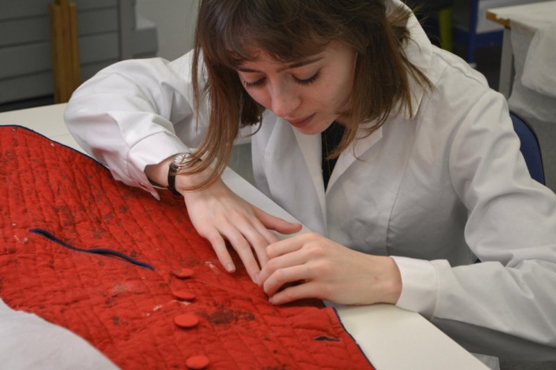 Assessing a Military Jacket from Dumfries Museum © University of Glasgow, 2016