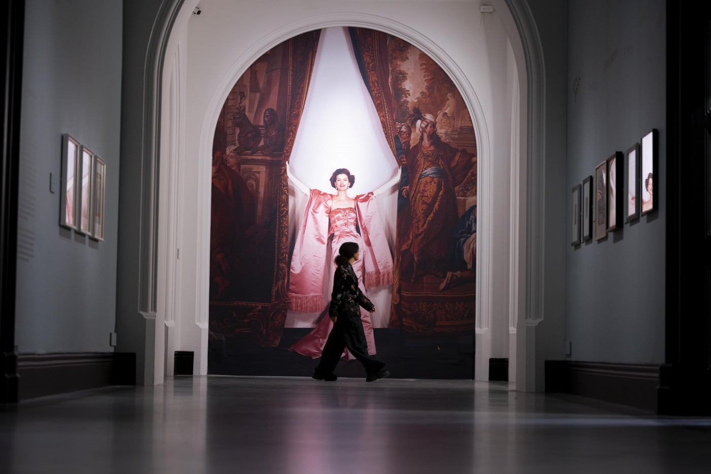 A visitor observing portraits in the exhibition Cecil Beaton’s fashionable World at the National Portrait Gallery.