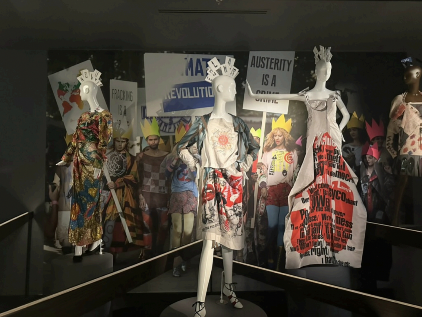 Vivienne Westwood, London fashion house England est. 1984 Vivienne Westwood designer England 1941–2022 Look 41, dress, necklace and shoes 2008 Chaos Point collection, autumn–winter 2008–09viscose silk (hand painted) leather, brass, crystal Vivienne Westwood Heritage, London<br />
<br />
Dress 2005 Propaganda collection, autumn–winter 2005–06 viscose, silk, cotton, metal and plastic (fastenings)Gift of Krystyna Campbell-Pretty AM and Family through the Australian Government’s Cultural Gifts Program, 2024<br />
<br />
Look 56, 56 dress 2007-56 collection, spring–summer 2008 silk (twill), leather, crystal. Vivienne Westwood Heritage, London. Display headpieces by Stephen Jones © Jane Francis / NGV