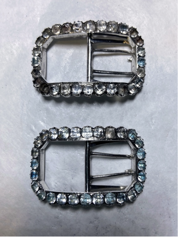 Buckles after conservation treatment.