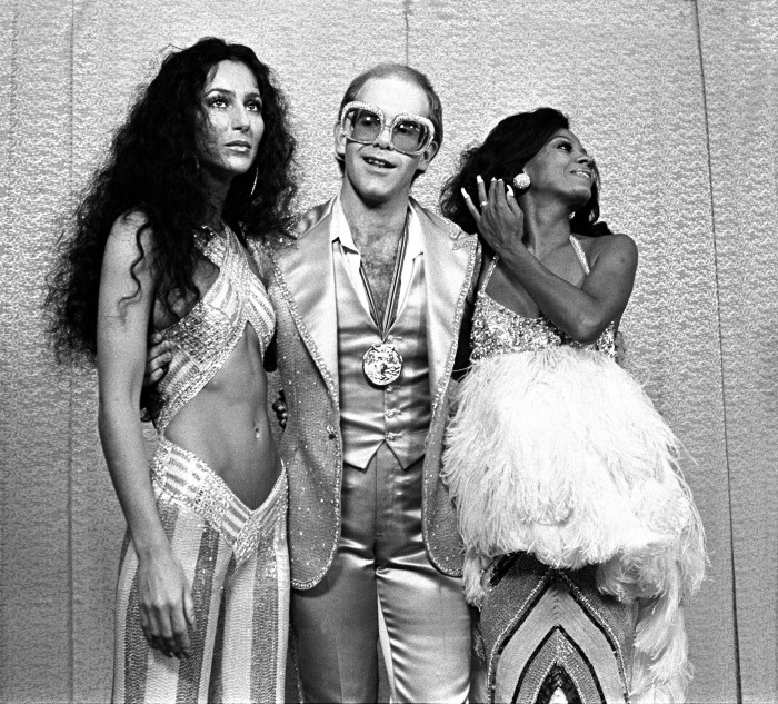 Cher, Elton John and Diana Ross at Rock Awards Santa Monica Civic Auditorium 1975; Various Locations; Mark Sullivan 70's Rock Archive Photo: Mark Sullivan/Contour by Getty Images.