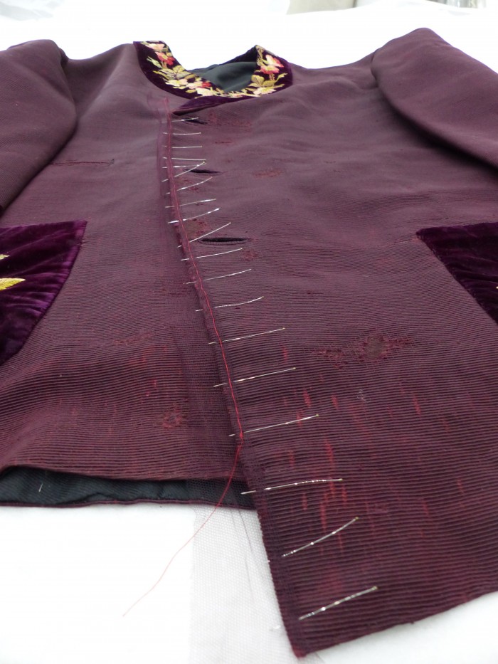 Edging the jacket front opening with dyed nylon net. 
A late 19th-century smoking jacket at Manchester Art Gallery.
Image copyright Zenzie Tinker Conservation Ltd.