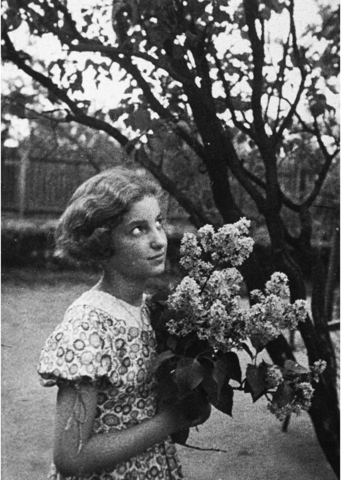 Figure 2: 'Loraine Sulzbacher holding a bunch of lilacs' 1939 (361.14), Jewish Museum London Archives.