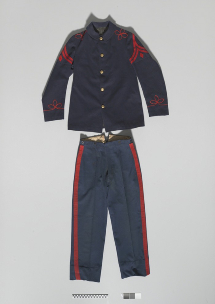 Man’s uniform coat/jacket and pants from Carlisle Indian School, 1885-1889
Wool cloth, cotton cloth, fabric trim, brass buttons, cotton thread. 
National Museum of the American Indian

