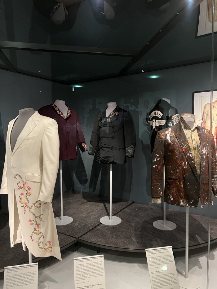 Jackets on display in the Decorated Dandy gallery, including the wool jacket conserved under the Elizabeth Hammond grant.