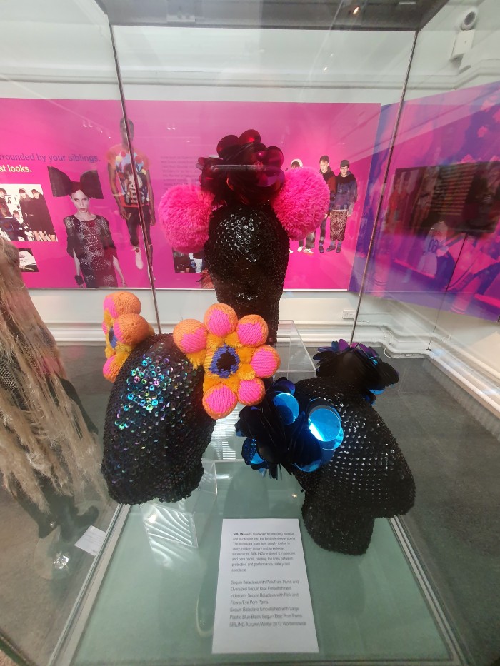 Sequin Balaclava with Pink Pom Poms and Oversized Sequin Disc Embellishment, Iridescent Sequin Balaclava with Pink and Flower/Eye Pom Poms, and Sequin Balaclava Embellished with Large Plastic Blue/Black Sequin Disc Pom Poms, all SIBLING Autumn/Winter 2012 Womenswear