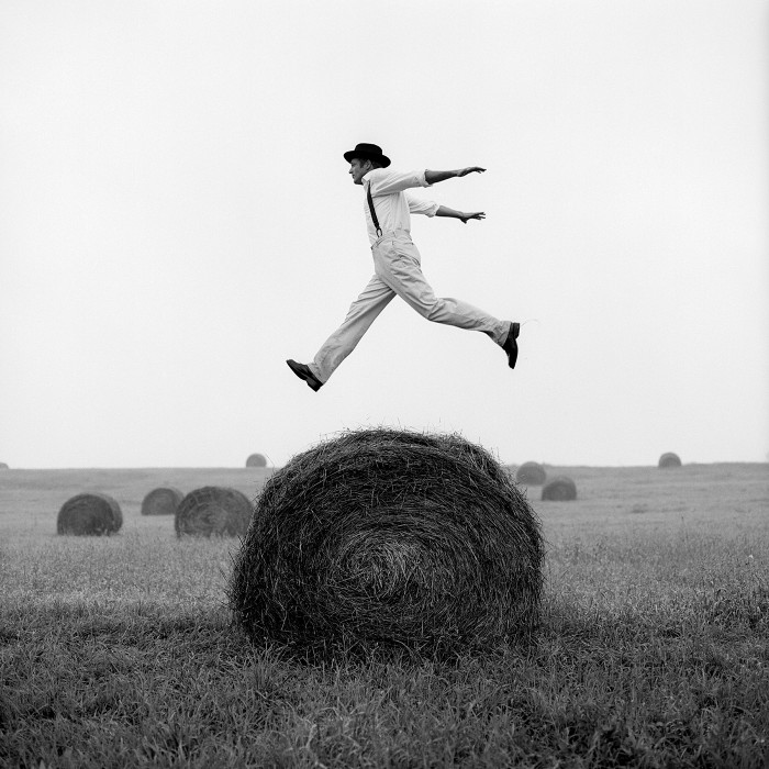 Don jumping over hay stack, Monkton, Maryland, 1999. Photograph Courtesy of Robert Klein Gallery.