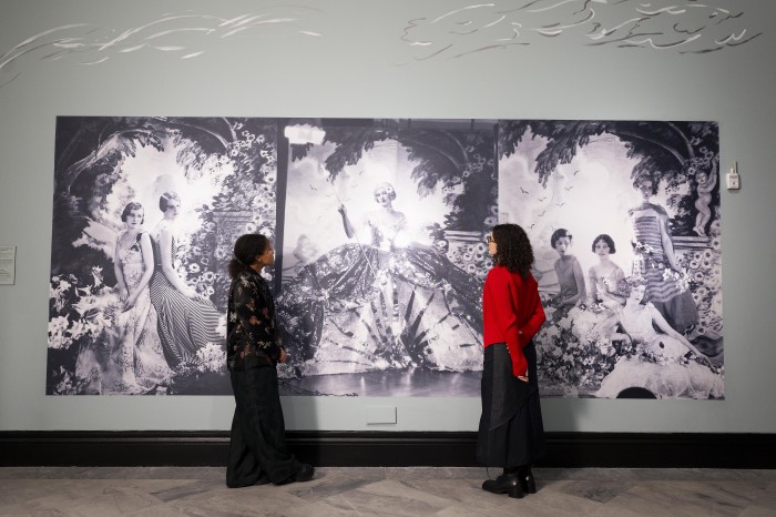 Visitors observing portraits in the exhibition Cecil Beaton’s fashionable World at the National Portrait Gallery.