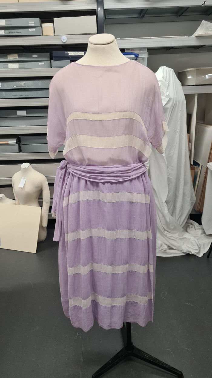 Final fitting for a day dress ahead of display